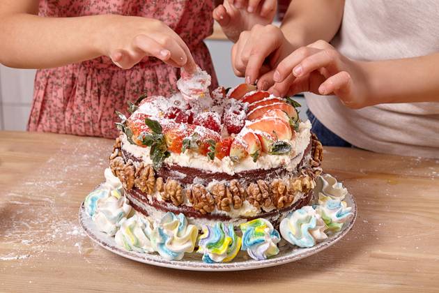 Little boy dressed in a light t-shirt and jeans and a girl wearing in a pink dress are making a cake at a kitchen. They are decorating the cake with some strawberry., model released, , 53269662.jpg, girl, boy, cake, child, cooking, flour, preparation, young, pretty, funny, home, kitchen, smile, background, studio, pie, sweet, little, indoor, fruits, children, interior, meal, marshmallow, table, colorful, furniture, wooden, t-shirt, jeans, dress, strawberry, braid, ingredients, raspberry, fresh, culinary, plate, childhood, powdered sugar, cheese, walnuts, dish, glass, orange, cream, male, female, kids, decorating RECORD DATE NOT STATED