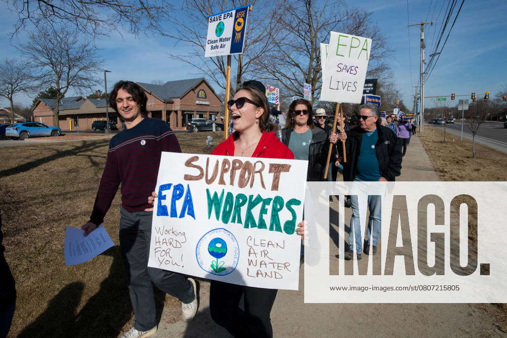 Ann Arbor, Michigan, USA: A woman holds a sign at a save-the-EPA-rally ...