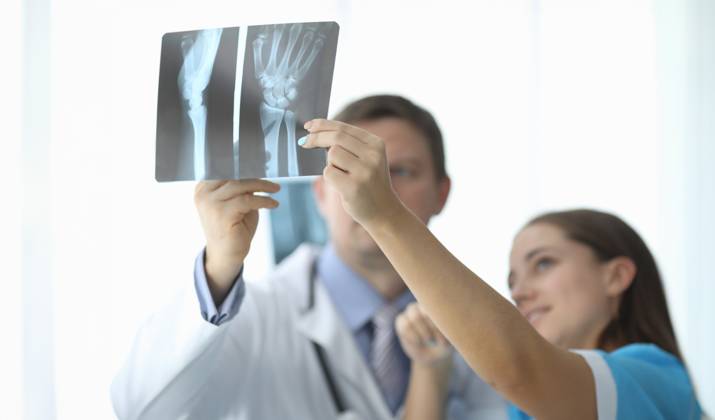 Close-up of female and male hands holding x-ray. Traumatologist and surgeon making diagnosis to patient. Practitioners discussing trauma. Traumatology and healthcare concept, model released, , 59009204.jpg, closeup, female, male, hand, holding, x-ray, skiagram, traumatologist, surgeon, diagnosis, patient, practitioner, discuss, trauma, traumatology, healthcare, concept, advice, colleague, work, hospital, look, xray, doctor, physician, examining, shadowgraph, therapist, medicine, disease, clinical, unhealthy, recovery, expert, clinic, specialist, healing, sick, illness, intern, practice, treatment, medic, medicines, professional, injury, diagnostic, cabinet, health, healthy RECORD DATE NOT STATED