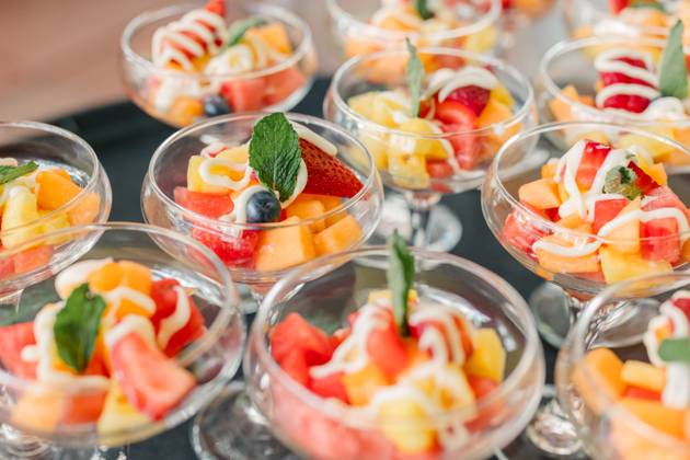 Fruit salad cups with yogurt drizzle and mint garnish Pittsburgh, Pennsylvania, United States R_QIWH250529-1745897-01