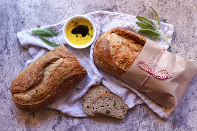 Stone Baked Light Rye Sourdough Bread Served with Olive Oil and Balsamic Vinegar. Stone Baked Light Rye Sourdough Bread Served with Olive Oil and Balsamic Vinegar. Copyright: xMilleflorexImagesx MIL140525-6