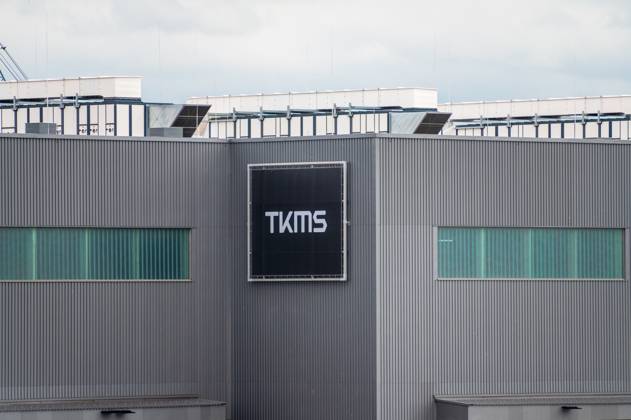 TKMS formerly TyssenKrupp Marinesystems in Kiel, the new halls for the construction of modern submarines Logo of TKMS