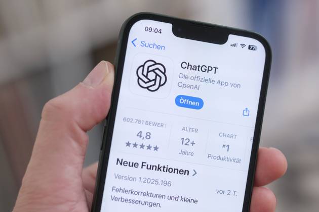 A cell phone with the Apple App Store page open shows the ChatGPT app for download. Symbolic image for artificial intelligence and the growing influence of AI applications in everyday life. Nordrhein-Westfalen Deutschland, Germany GMS19584