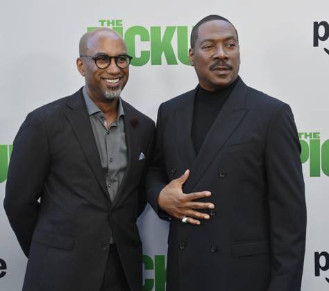 Director Tim Story (L) and cast member Eddie Murphy attend the premiere of the motion picture comedy The Pickup at Regal LA Live in Los Angeles on Sunday, July 27, 2025. Storyline: A routine cash pickup turns into a deadly pursuit when two mismatched armored truck drivers are ambushed by ruthless criminals with plans beyond the cash.  LAP2025072745 JIMxRUYMEN