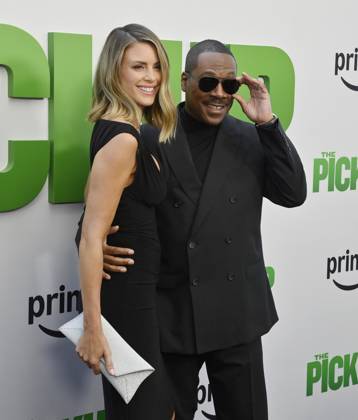 Cast member Eddie Murphy and his wife Paige Butcher attend the premiere of the motion picture comedy The Pickup at Regal LA Live in Los Angeles on Sunday, July 27, 2025. Storyline: A routine cash pickup turns into a deadly pursuit when two mismatched armored truck drivers are ambushed by ruthless criminals with plans beyond the cash.  LAP2025072750 JIMxRUYMEN