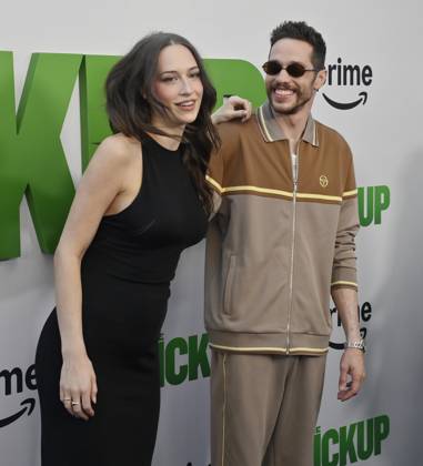 Cast member Pete Davidson (R) and Elsie Hewitt attend the premiere of the motion picture comedy The Pickup at Regal LA Live in Los Angeles on Sunday, July 27, 2025. Storyline: A routine cash pickup turns into a deadly pursuit when two mismatched armored truck drivers are ambushed by ruthless criminals with plans beyond the cash.  LAP2025072703 JIMxRUYMEN