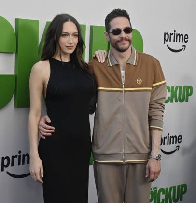 Cast member Pete Davidson (R) and Elsie Hewitt attend the premiere of the motion picture comedy The Pickup at Regal LA Live in Los Angeles on Sunday, July 27, 2025. Storyline: A routine cash pickup turns into a deadly pursuit when two mismatched armored truck drivers are ambushed by ruthless criminals with plans beyond the cash.  LAP2025072705 JIMxRUYMEN