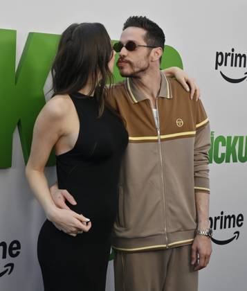 Cast member Pete Davidson (R) and Elsie Hewitt attend the premiere of the motion picture comedy The Pickup at Regal LA Live in Los Angeles on Sunday, July 27, 2025. Storyline: A routine cash pickup turns into a deadly pursuit when two mismatched armored truck drivers are ambushed by ruthless criminals with plans beyond the cash.  LAP2025072717 JIMxRUYMEN
