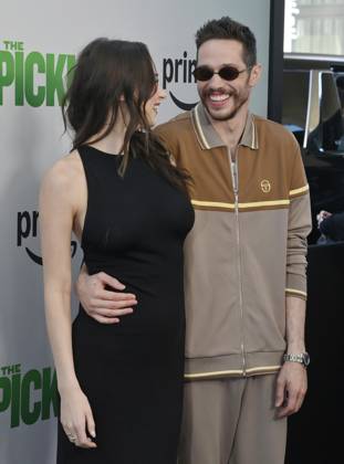 Cast member Pete Davidson (R) and Elsie Hewitt attend the premiere of the motion picture comedy The Pickup at Regal LA Live in Los Angeles on Sunday, July 27, 2025. Storyline: A routine cash pickup turns into a deadly pursuit when two mismatched armored truck drivers are ambushed by ruthless criminals with plans beyond the cash.  LAP2025072718 JIMxRUYMEN