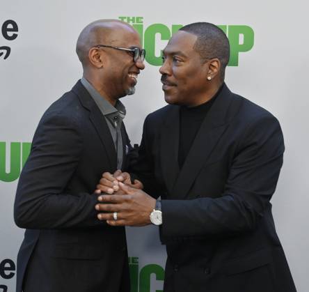 Director Tim Story (L) and cast member Eddie Murphy attend the premiere of the motion picture comedy The Pickup at Regal LA Live in Los Angeles on Sunday, July 27, 2025. Storyline: A routine cash pickup turns into a deadly pursuit when two mismatched armored truck drivers are ambushed by ruthless criminals with plans beyond the cash.  LAP2025072743 JIMxRUYMEN