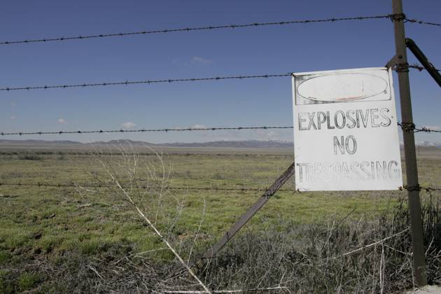 Utah: US Nuclear Waste Dumping Ground Mar 25, 2005; Skull Valley, UT, USA; Skull Valley is on the Goshute Indian Reservation in north-western Utah. Nestled between two ranges of snow-capped mountains, the valley is adjacent to Dugway, the US Army Proving Grounds for Chemical and Biological Weapons. On the reservation, the Tekio Test Range warns of explosives and is visited by weapons treaty experts. And soon, Private Fuel Storage LLC, may be building a facility for the temporary (40 years) storage of radioactive waste from nuclear reactors throughout the US. The Tekio Test Range is just a few miles from the proposed location of the radioactive waste site. Skull Valley UT USA Copyright: xMikexFoxx