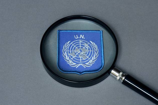 Magnifying glass with UN emblem Magnifying glass with UN emblem, 06 09 2025, Borkwalde, Brandenburg, There is a UN emblem under a magnifying glass