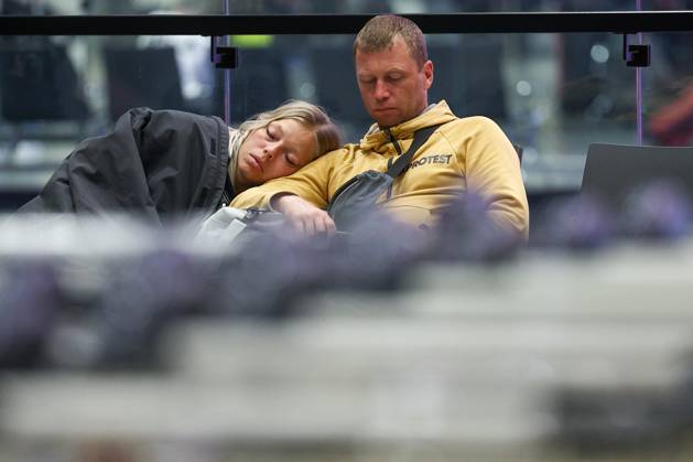RUSSIA, MOSCOW REGION - SEPTEMBER 17, 2025: A woman sleeps on a man s shoulder at Sheremetyevo International Airport. Sofya Sandurskaya TASS  84064008