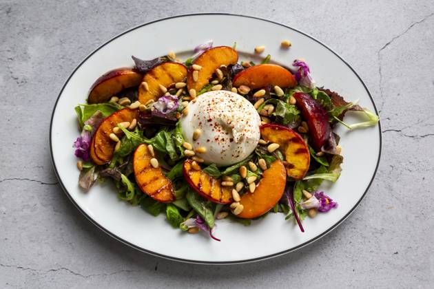 Grilled nectarine and burrata salad with pine nuts and edible flowers, SARF04684