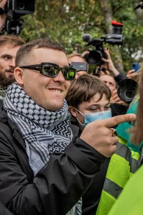 September 26, 2025, London, United Kingdom: Mo Chara of Belfast rap group Kneecap celebrates outside Woolwich Crown Court, having been acquitted of all charges. The 27 year old (real name Liam Og O hAnnaidh) was acquitted of all charges. Hundreds of Kneecap supporters and pro-Palestinian protesters were present to oppose the charge and to celebrate his acquittal. London United Kingdom - ZUMAs197 20250926_aaa_s197_208 Copyright: xLabxKyxMox