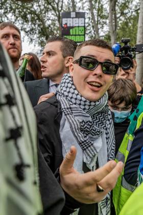 September 26, 2025, London, United Kingdom: Mo Chara of Belfast rap group Kneecap celebrates outside Woolwich Crown Court, having been acquitted of all charges. The 27 year old (real name Liam Og O hAnnaidh) was acquitted of all charges. Hundreds of Kneecap supporters and pro-Palestinian protesters were present to oppose the charge and to celebrate his acquittal. London United Kingdom - ZUMAs197 20250926_aaa_s197_219 Copyright: xLabxKyxMox