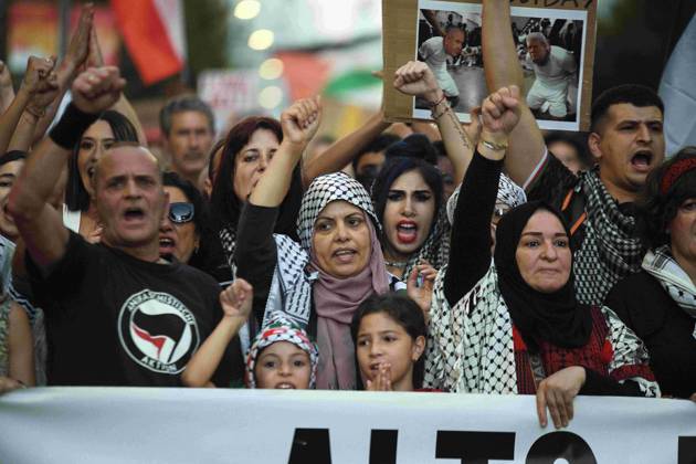 October 4, 2025, Madrid, Madrid, Spain: Protesters hold banners and Palestinian banners during a demonstration in solidarity with the Palestinians in the Gaza strip, in Madrid. Madrid Spain - ZUMA- Oc 20251004_zsp_d308_014 Copyright: xJuanxCarlosxLucasx