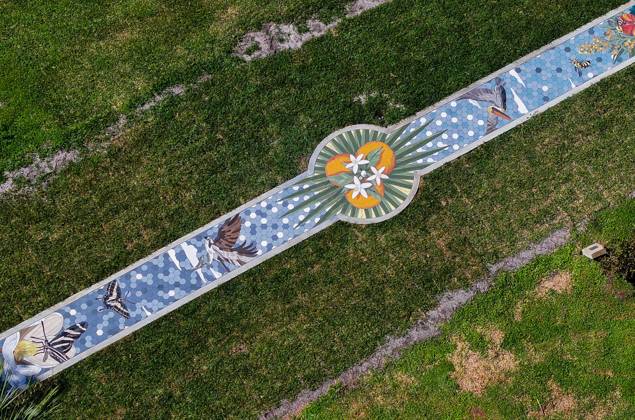 October 13, 2025, St. Petersburg, Florida, USA: An aerial drone view of The Sunshine City Mosaic sidewalk mural at Sunset Park, 7340 Central Ave, on Monday, Oct. 13, 2025 in St. Petersburg. The 175 foot long side walk mural is the largest in the Southeast. St. Petersburg USA - ZUMAs70_ 20251013_zan_s70_049 Copyright: xDirkxShaddx