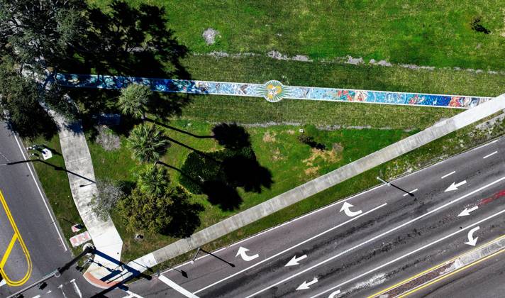 October 13, 2025, St. Petersburg, Florida, USA: An aerial drone view of The Sunshine City Mosaic sidewalk mural at Sunset Park, 7340 Central Ave, on Monday, Oct. 13, 2025 in St. Petersburg. The 175 foot long side walk mural is the largest in the Southeast. St. Petersburg USA - ZUMAs70_ 20251013_zan_s70_044 Copyright: xDirkxShaddx
