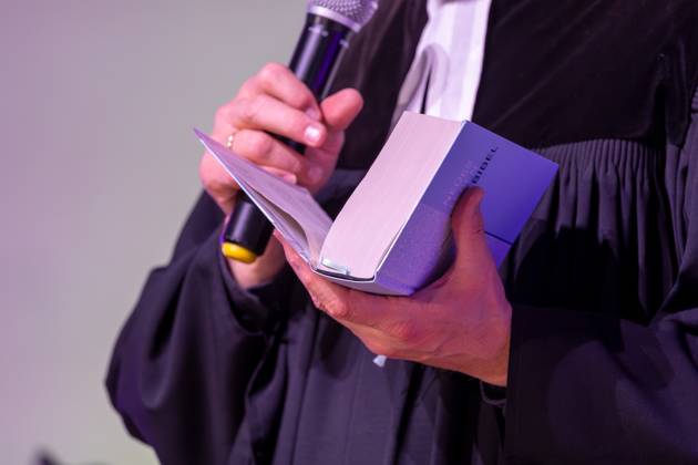 Protestant pastor holding a Bible in his hand Symbolic image church Copyright: xUdoxHerrmannx