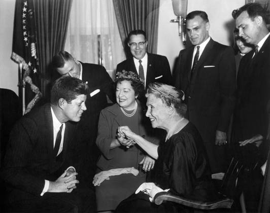 U.S. President John F. Kennedy meeting with Helen Keller (seated right), as her personal secretary Evelyn Seide (seated left) and members of the Lions Clubs International look on, White House, Washington, D.C., USA, Abbie Rowe, White House Photographs, April 8, 1961  Copyright: xCircaxImagesx ghi-circa13716