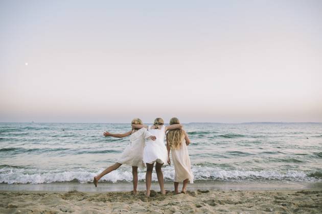 Friends embracing by the seaside expressing connection and joy model released, Symbolfoto, SIF01481