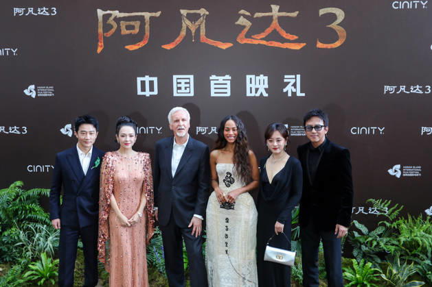 SANYA, CHINA - DECEMBER 08: (L-R) Actor Huang Xuan, actress Zhang Ziyi, director James Cameron, American actress Zoe Saldana, actress Susan Sun Li and actor Deng Chao attend the China premiere of film Avatar: Fire and Ash on December 8, 2025 in Sanya, Hainan Province of China.  Copyright: xChinaxNewsxServicex 111608442418