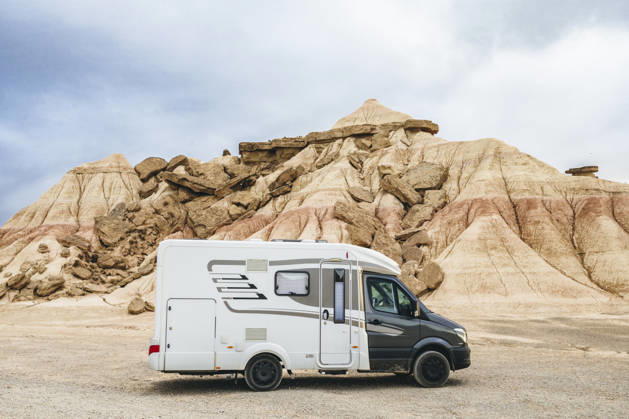 Motorhome parked in the Bardenas Reales Natural Park, Navarra, Spain. Road trip and van life adventure through the arid desert landscape of northern Spain. Model Released SylviePm_ID32630_1111742_016 Copyright: xx RECORD DATE NOT STATED