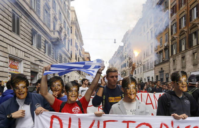 Students protest in Rome ROME, ITALY - OCTOBER 09: Students wear masks portraying German chancellor Angela Merkel march during a demonstration on the occasion of a strike against the Italian government s school reform in Rome, Italy October 9, 2015. Some students held pro-refugee placards during the demonstration on Friday. Rome Lazio. Editorial use only. Please get in touch for any other usage.  Copyright: x2025xAnadoluxRiccardoxDexLucax