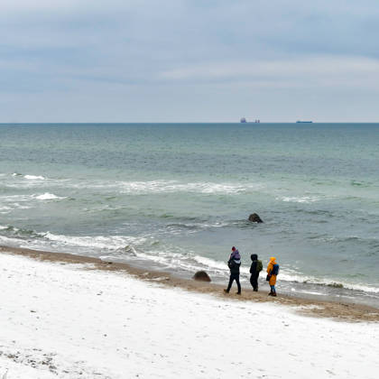 Baltic Sea in winter People walking on the wintry Baltic Sea beach at the Wilhelmshöhe near Warnemünde Warnemünde Mecklenburg Western Pomerania Germany JK15319