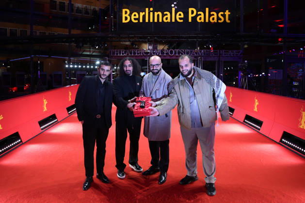 February 21, 2026, Berlin, Germany: Director Abdallah Alkhatib (C-L) and Producer Taqiyeddine Issaad (C-R) pose with the GWFF Best Feature Film Debut Award for Chronicles From the Siege after the closing ceremony of the 76th Berlin International Film Festival (Berlinale), Europe s first major film festival of the year, in Berlin. The festival runs from February 12 to 22, 2026. Berlin Germany - ZUMAf146 20260221_zip_f146_043 Copyright: xRouzbehxFouladix