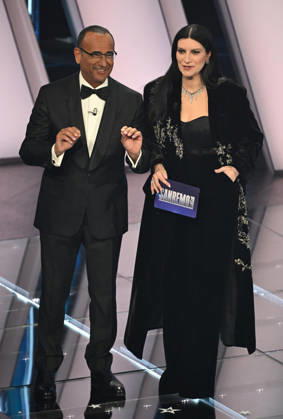 February 25, 2026, Sanremo, ITALY: (L-R)Sanremo Festival host and artistic director Carlo Conti and Italian singer Laura Pausini on stage at the Ariston theatre during the 76th edition of the Sanremo Italian Song Festival, in Sanremo, Italy, 25 February 2026. The music festival will run from 24 to 28 February 2026. ANSA RICCARDO ANTIMIANI. Sanremo ITALY - ZUMAa110 20260225_zaf_a110_171 Copyright: xRiccardoxAntimianix