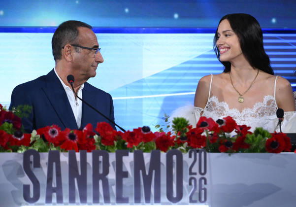 February 26, 2026, Sanremo, ITALY: (L-R) Sanremo Festival host and artistic director Carlo Conti and Russian model Irina Shayk attend a press conference at the 76th Sanremo Italian Song Festival, Sanremo, Italy, 26 February 2026. The Music Festival runs from 24 to 28 February 2026. ANSA ETTORE FERRARI Sanremo ITALY - ZUMAa110 20260226_zaf_a110_049 Copyright: xEttorexFerrarix