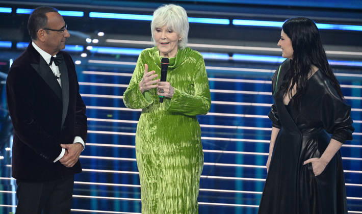 February 27, 2026, Sanremo, ITALY: (L-R) Sanremo Festival host and artistic director Carlo Conti, Italian singer Caterina Caselli and Italian singer Laura Pausini on stage at the Ariston theatre during the 76th edition of the Sanremo Italian Song Festival, in Sanremo, Italy, 27 February 2026. The music festival will run from 24 to 28 February 2026. ANSA RICCARDO ANTIMIANI. Sanremo ITALY - ZUMAa110 20260227_zaf_a110_205 Copyright: xRiccardoxAntimianix