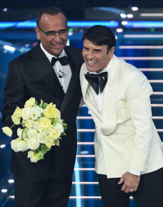 February 28, 2026, Sanremo, ITALY: (L-R) Sanremo Festival host and artistic director Carlo Conti with Italian singer Sal Da Vinci on stage at the Ariston theatre during the 76th edition of the Sanremo Italian Song Festival, in Sanremo, Italy, 28 February 2026. The Music Festival runs from 24 to 28 February 2026. ANSA ETTORE FERRARI Sanremo ITALY - ZUMAa110 20260228_zaf_a110_211 Copyright: xEttorexFerrarix