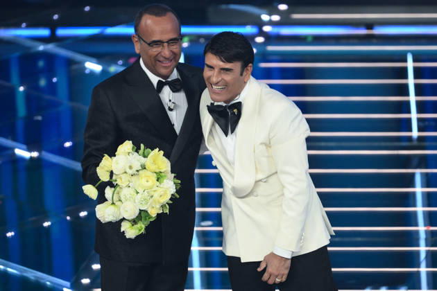 February 28, 2026, Sanremo, ITALY: (L-R) Sanremo Festival host and artistic director Carlo Conti with Italian singer Sal Da Vinci on stage at the Ariston theatre during the 76th edition of the Sanremo Italian Song Festival, in Sanremo, Italy, 28 February 2026. The Music Festival runs from 24 to 28 February 2026. ANSA ETTORE FERRARI Sanremo ITALY - ZUMAa110 20260228_zaf_a110_212 Copyright: xEttorexFerrarix