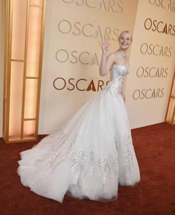Elle Fanning arrives on the red carpet for the 98th annual Academy Awards in the Hollywood section of Los Angeles on Sunday, March 15, 2026. Conan O Brien will host the Oscars for the second consecutive year.  LAP20260315192 JIMxRUYMEN