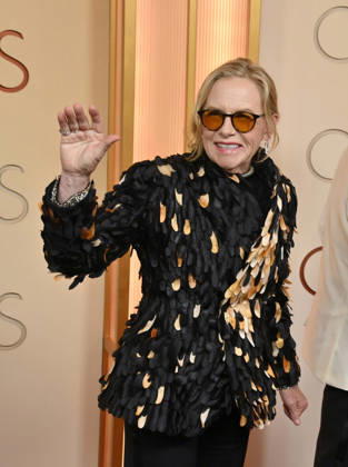 Amy Madigan arrives on the red carpet for the 98th annual Academy Awards in the Hollywood section of Los Angeles on Sunday, March 15, 2026. Conan O Brien will host the Oscars for the second consecutive year.  LAP20260315195 JIMxRUYMEN