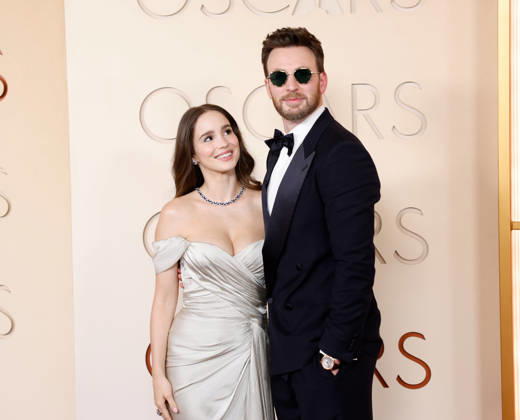 (L-R) Alba Baptista and Chris Evans attend the 98th Oscars on the red carpet for the 98th annual Academy Awards in the Hollywood section of Los Angeles on Sunday, March 15, 2026. Conan O Brien will host the Oscars for the second consecutive year.  LAP20260315664 JOHNxANGELILLO
