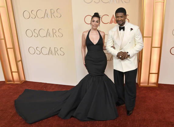Jennifer Goicoechea and Usher arrive on the red carpet for the 98th annual Academy Awards in the Hollywood section of Los Angeles on Sunday, March 15, 2026. Conan O Brien will host the Oscars for the second consecutive year.  LAP20260315217 JIMxRUYMEN