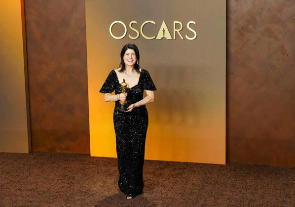 Cassandra Kulukundis celebrates in the press photo room after winning the Best Casting Oscar for One Battle After Another during the 98th annual Academy Awards in the Hollywood section of Los Angeles on Sunday, March 15, 2026. Conan O Brien is hosting the Oscars for the second consecutive year.  LAP20260315332 BONNIExCASH