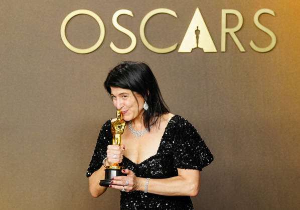 Cassandra Kulukundis celebrates in the press photo room after winning the Best Casting Oscar for One Battle After Another during the 98th annual Academy Awards in the Hollywood section of Los Angeles on Sunday, March 15, 2026. Conan O Brien is hosting the Oscars for the second consecutive year. LAP20260315334 BONNIExCASH
