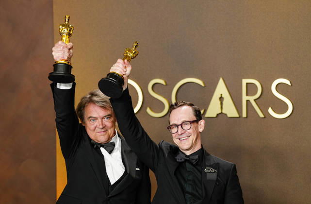Chris Lavis and Maciek Szczerbowski celebrate in the press photo room after winning the Best Animated Short Film Oscar for The Girl Who Cried Pearls during the 98th annual Academy Awards in the Hollywood section of Los Angeles on Sunday, March 15, 2026. Conan O Brien is hosting the Oscars for the second consecutive year.  LAP202603152307 BONNIExCASH