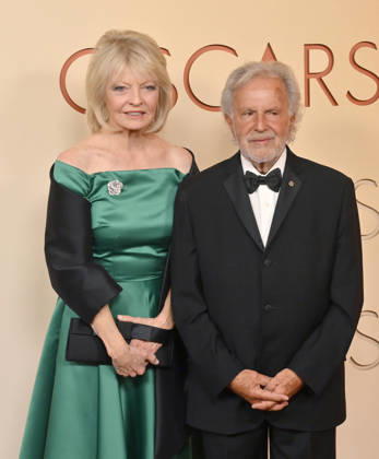 Nancy Hult Ganis and Sid Ganis arrive on the red carpet for the 98th annual Academy Awards in the Hollywood section of Los Angeles on Sunday, March 15, 2026. Conan O Brien will host the Oscars for the second consecutive year.  LAP20260315320 JIMxRUYMEN