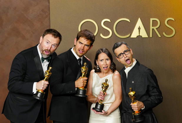 Natalie Musteata and Alexander Singh celebrate in the press photo room after winning the Best Live Action Short Film Oscar for Two People Exchanging Saliva during a tie with Sam A. Davis and Jack Piatt for The Singer in the 98th annual Academy Awards in the Hollywood section of Los Angeles on Sunday, March 15, 2026. Conan O Brien is hosting the Oscars for the second consecutive year.  LAP20260315360 BONNIExCASH