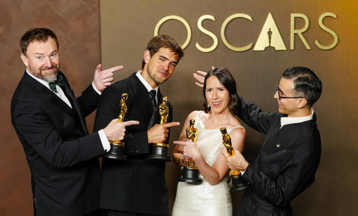 Natalie Musteata and Alexander Singh celebrate in the press photo room after winning the Best Live Action Short Film Oscar for Two People Exchanging Saliva during a tie with Sam A. Davis and Jack Piatt for The Singer in the 98th annual Academy Awards in the Hollywood section of Los Angeles on Sunday, March 15, 2026. Conan O Brien is hosting the Oscars for the second consecutive year.  LAP20260315361 BONNIExCASH