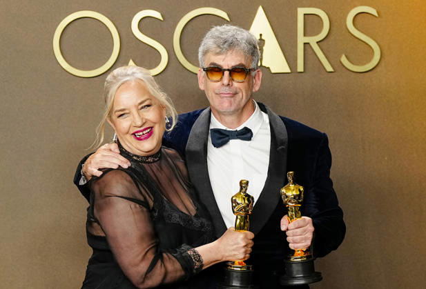 Tamara Deverell and Shane Vieau celebrate in the press photo room after winning the Best Production Design Oscar for Frankenstein during the 98th annual Academy Awards in the Hollywood section of Los Angeles on Sunday, March 15, 2026.  LAP20260315367 BONNIExCASH