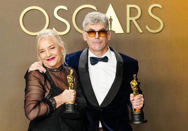 Tamara Deverell and Shane Vieau celebrate in the press photo room after winning the Best Production Design Oscar for Frankenstein during the 98th annual Academy Awards in the Hollywood section of Los Angeles on Sunday, March 15, 2026.  LAP20260315369 BONNIExCASH