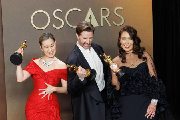 March 15, 2026, Hollywood, California, USA: (L-R) Maggie Kang, Chris Appelhans, and Michelle L.M. Wong, winners of the Best Animated Feature Film Award for â€oeKPop Demon Huntersâ€Â, pose in the press room of the 98th Annual Academy Awards on Sunday March 15, 2026 at the Dolby Theater in Hollywood, California. PRENSA INTERNACIONAL Hollywood USA - ZUMAp124 20260315_zaa_p124_300 Copyright: xPrensaxInternacionalx