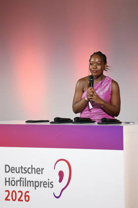 German Audio Film Award, Award Ceremony at the Colosseum Cinema, Berlin, 24 03 2026 Kathy Etoa gives the laudatory speech for the Documentary category at the German Audio Film Award Ceremony at the Colosseum Cinema in Berlin on 24 03 2026 Berlin Cinema Collosseum Copyright: xRenÃ xduxVinagex